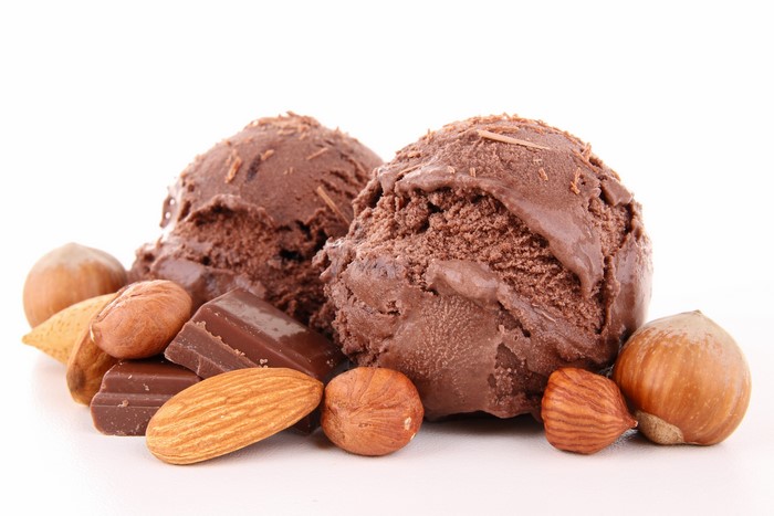 Chocolate ice cream scoops with nuts and chocolate pieces