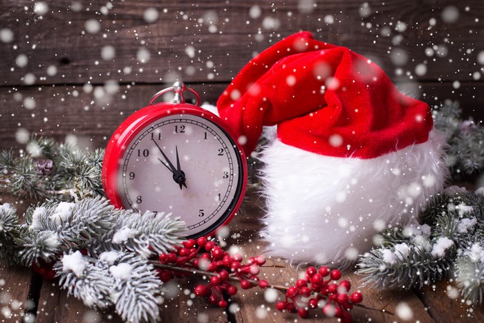 Christmas clock with Santa hat and snow