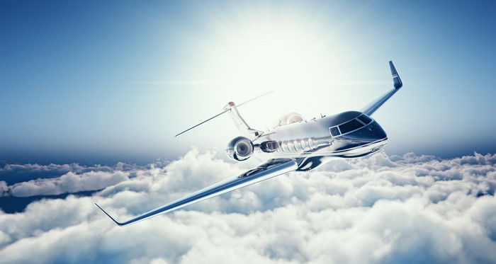 Learjet 45 flying above clouds