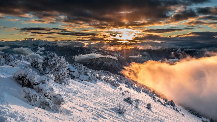 Snowy mountains in Sarcenas, France during sunset
