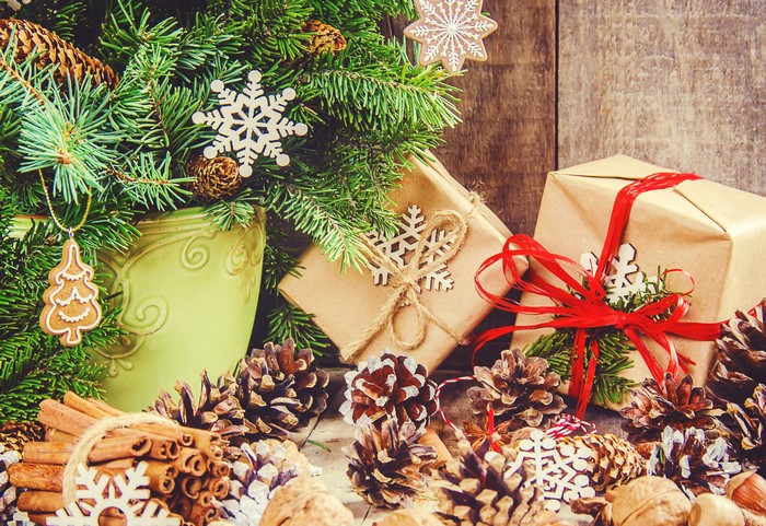Christmas tree with gifts, pine cones, and cinnamon