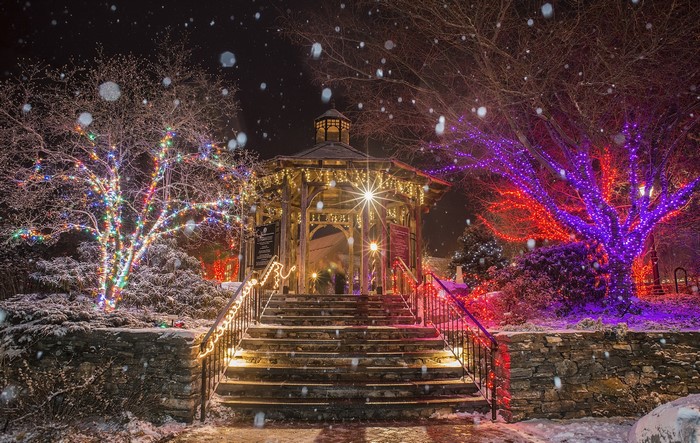 Gazebo and trees decorated with Christmas lights in Boylston, USA