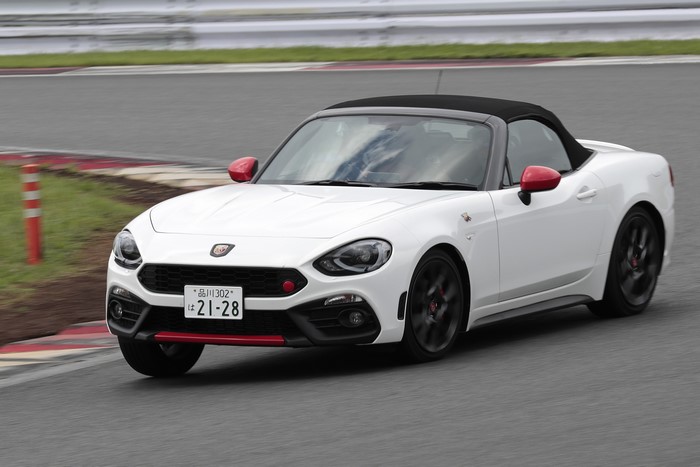 White Abarth 124 Spider convertible on a race track