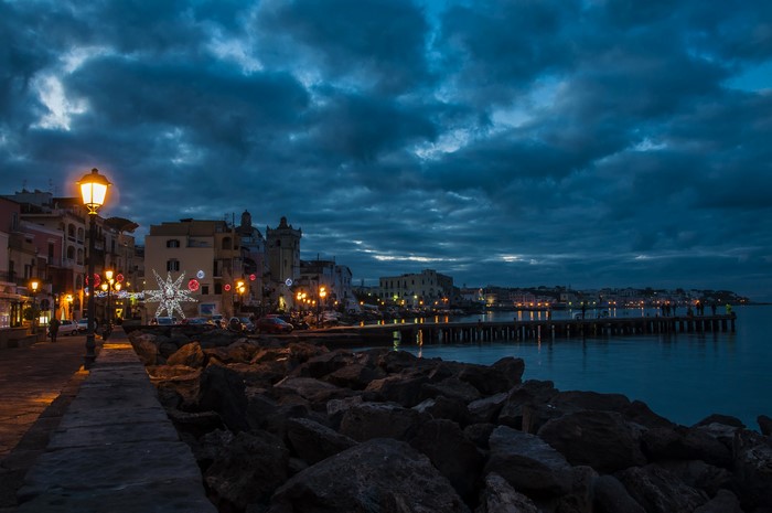 Ischia Ponte Italy coast at dusk with street lights