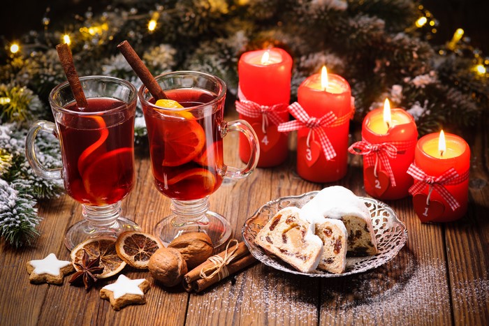 Christmas mulled wine with candles and stollen
