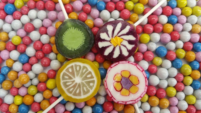 Four lollipops and dragees