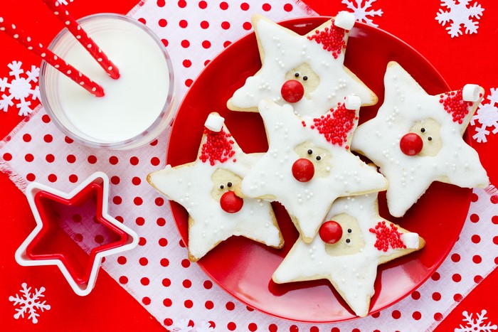Christmas star cookies with milk and snowflakes