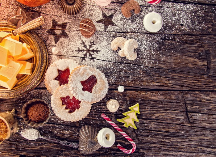 Christmas cookies and butter on wooden planks