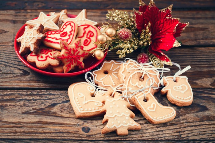 Christmas cookies on wooden planks with poinsettia