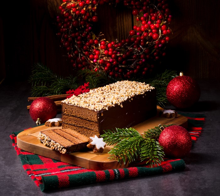Chocolate cake with nuts and Christmas decorations
