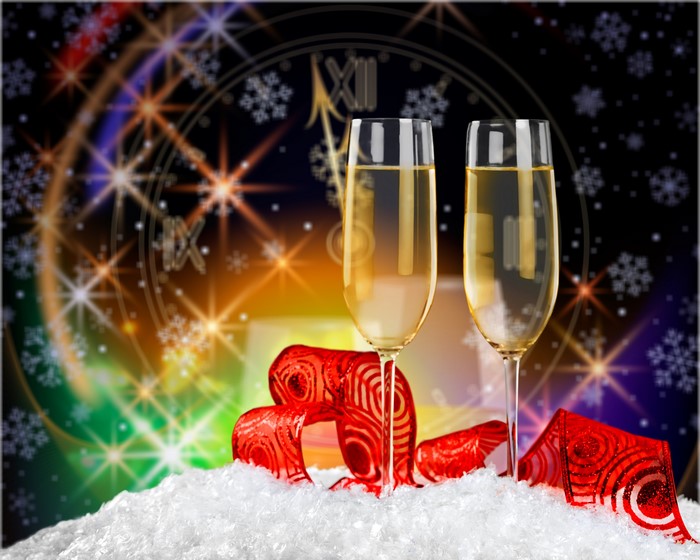 Champagne glasses with ribbon and snow