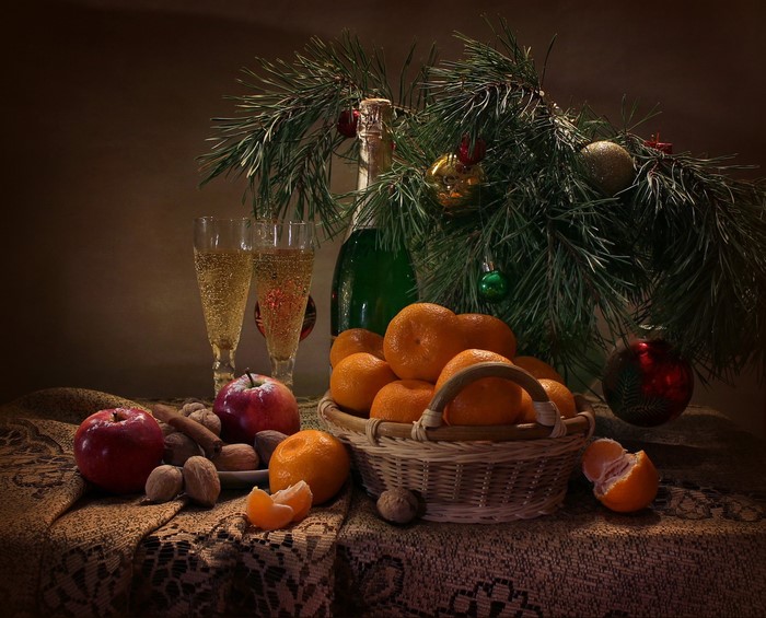 Christmas still-life with champagne, fruit, and ornaments