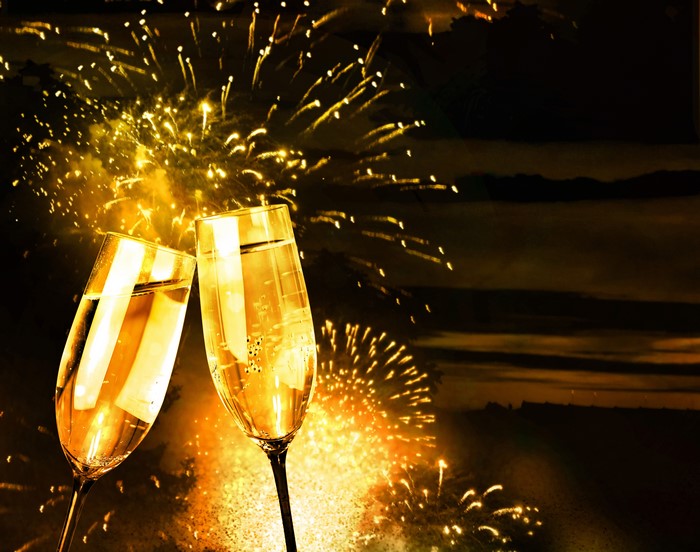 Champagne Glasses and Fireworks