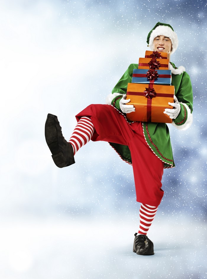 Elf carrying stacked Christmas gifts