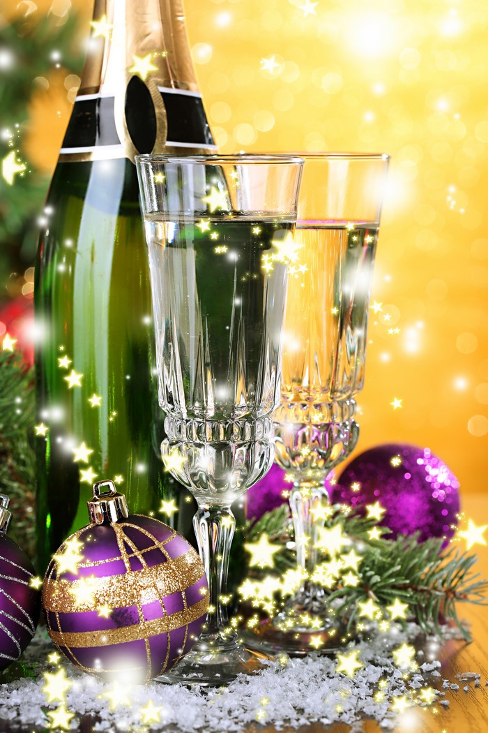 Champagne bottle and glasses with Christmas ornaments