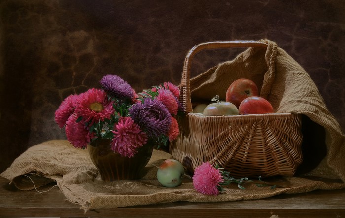 Still-life with asters and apples in a wicker basket