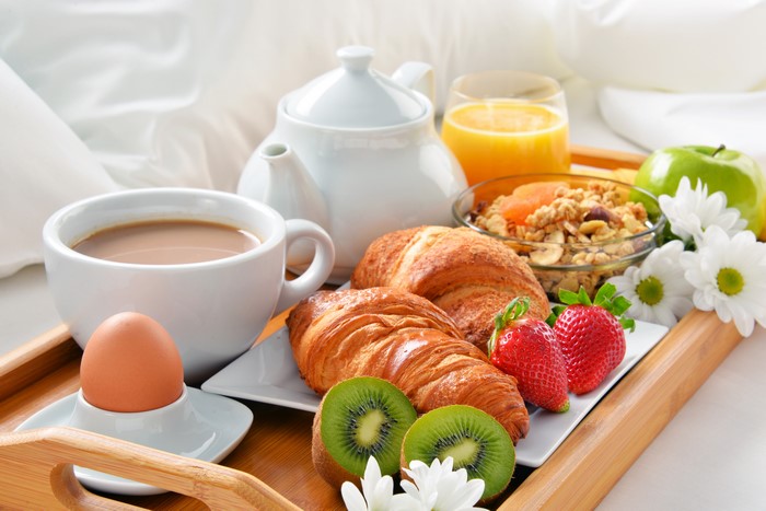 Breakfast Tray with Croissants, Coffee, and Fruit