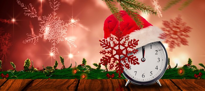 Christmas clock with Santa hat and snowflakes