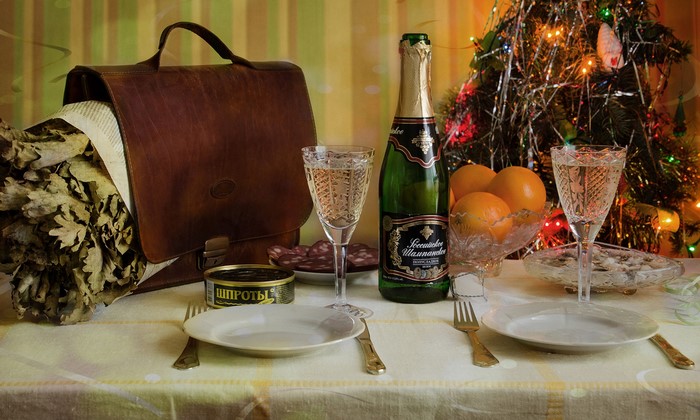 Christmas table setting with champagne and oranges
