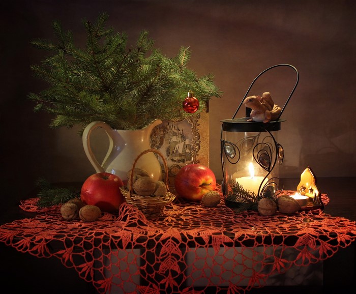 Christmas still-life with apples, nuts, and candles