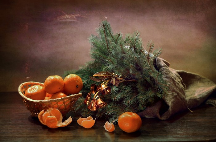 Christmas still-life with tangerines and fir branches
