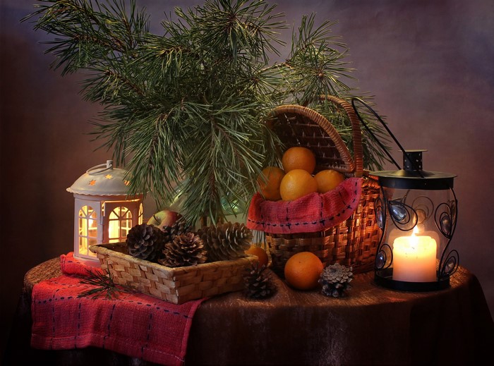 Christmas still-life with oranges, pine cones, and lanterns
