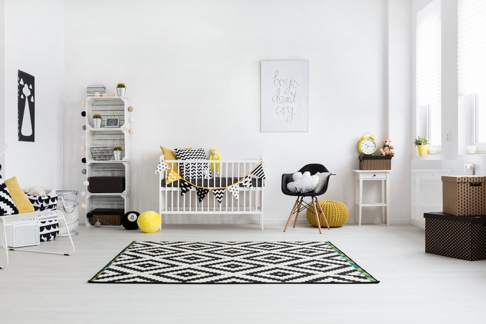 Children's room with crib and modern furniture