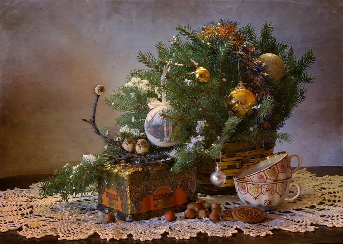 Christmas still-life with fir branches, ornaments, and tea set