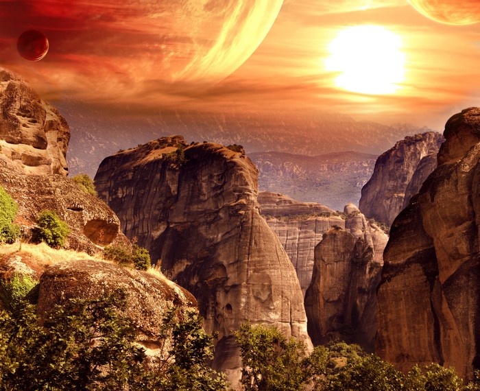 Alien landscape with rocky mountains and planets