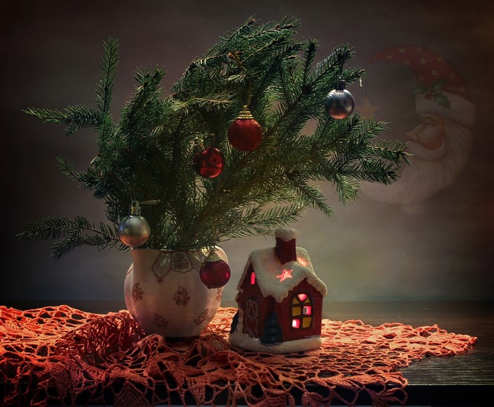 Christmas tree with ornaments and a house decoration