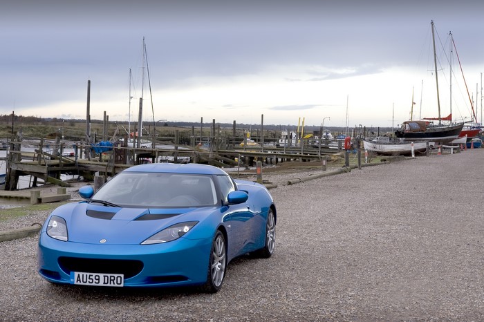 Blue Lotus Evora parked at a marina