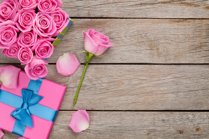 Pink Roses and Gift Box on Wood