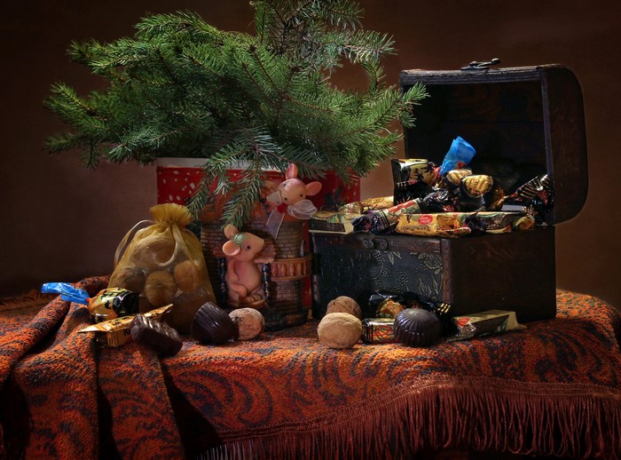 Still-life with Christmas tree, nuts, and chocolates