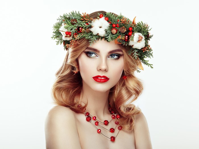 Woman with Christmas wreath and red necklace