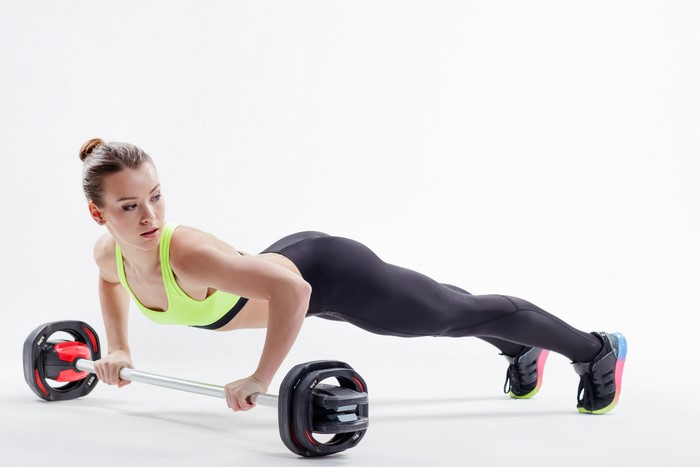 Woman Doing Push-Up Exercise with Barbell 4K
