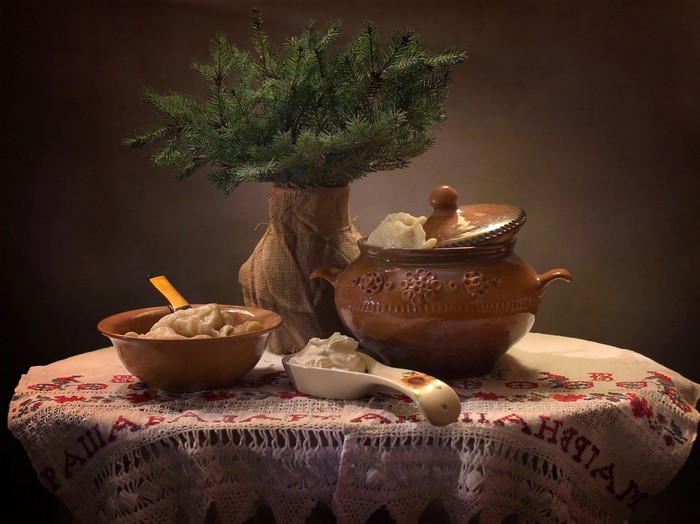 Still life with dumplings and fir branches