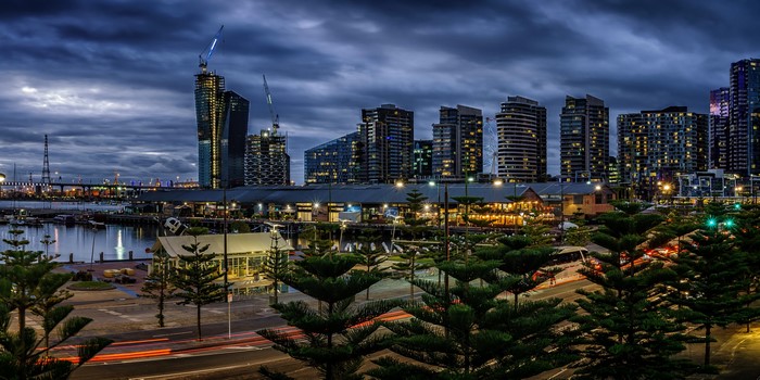 Melbourne skyline at dusk with harbor and trees