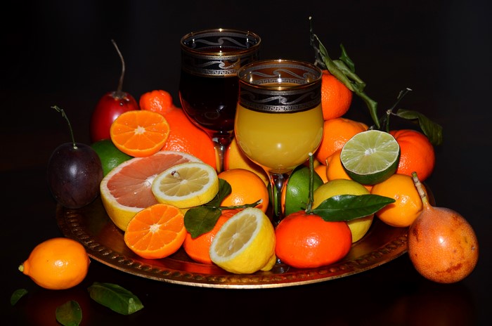 Citrus fruits and juice in stemware
