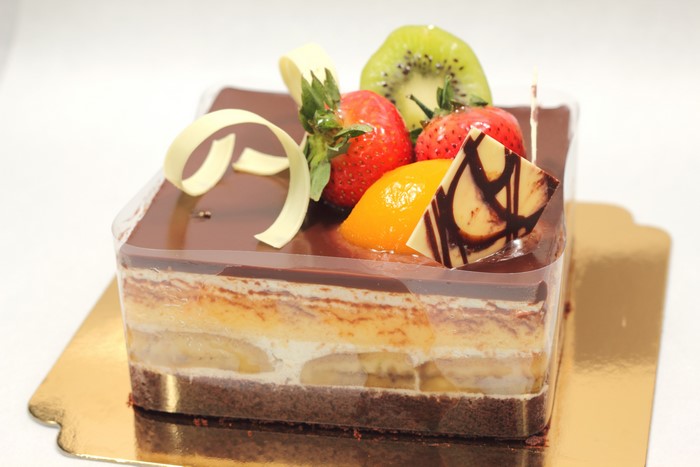 Chocolate fruit cake with strawberries and kiwi