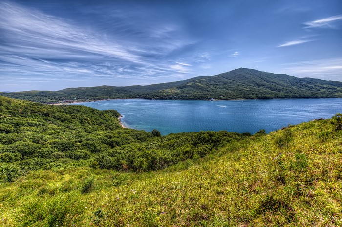 Scenic bay with green hills and blue sky in Vladivostok, Russia