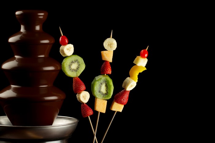 Chocolate fountain with fruit skewers