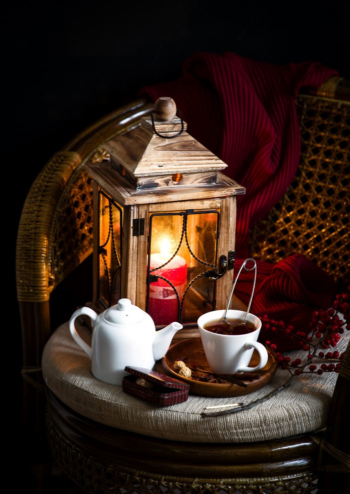 Still-life with tea set, lantern, and candle