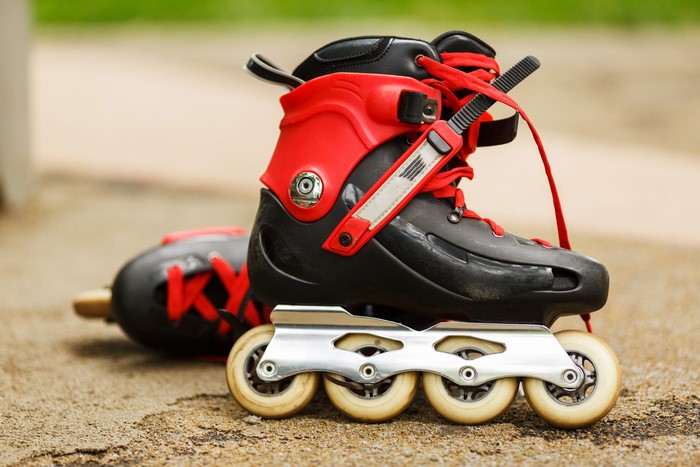Roller skates with red laces and black boots
