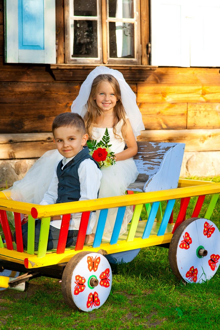 Bride and Groom in a Colorful Wagon