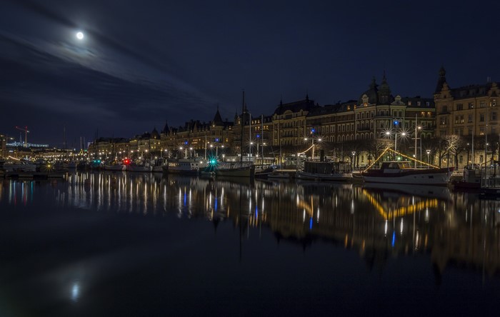 Stockholm at night with moon and river