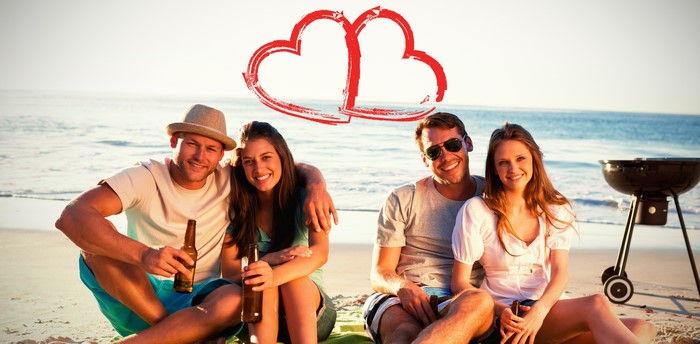 Couple on Beach with Barbecue and Hearts
