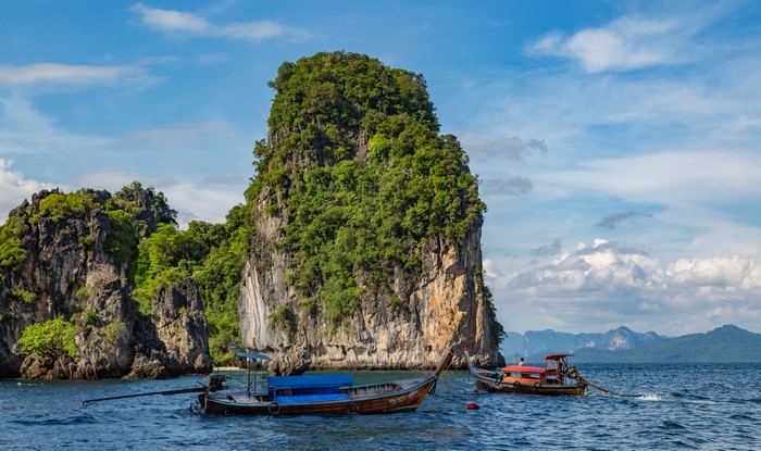 Longtail boats near limestone karsts in Thailand