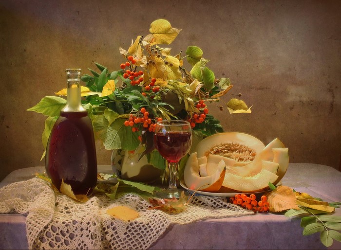 Still-life with wine, melon, and rowan berries