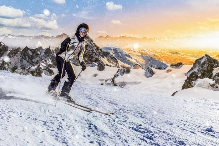 4K Skiing in Snowy Mountains at Sunset