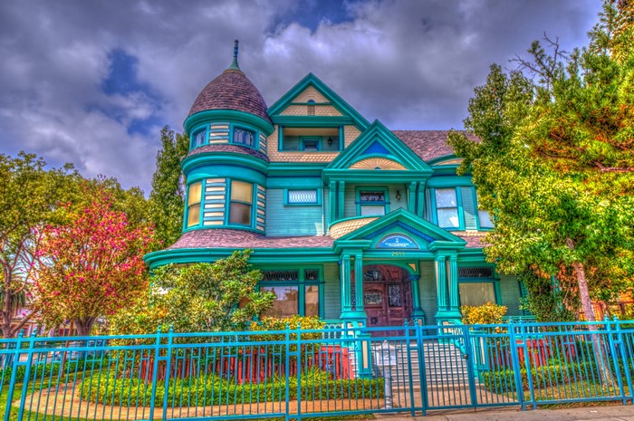 Victorian House with Turret and Blue Fence
